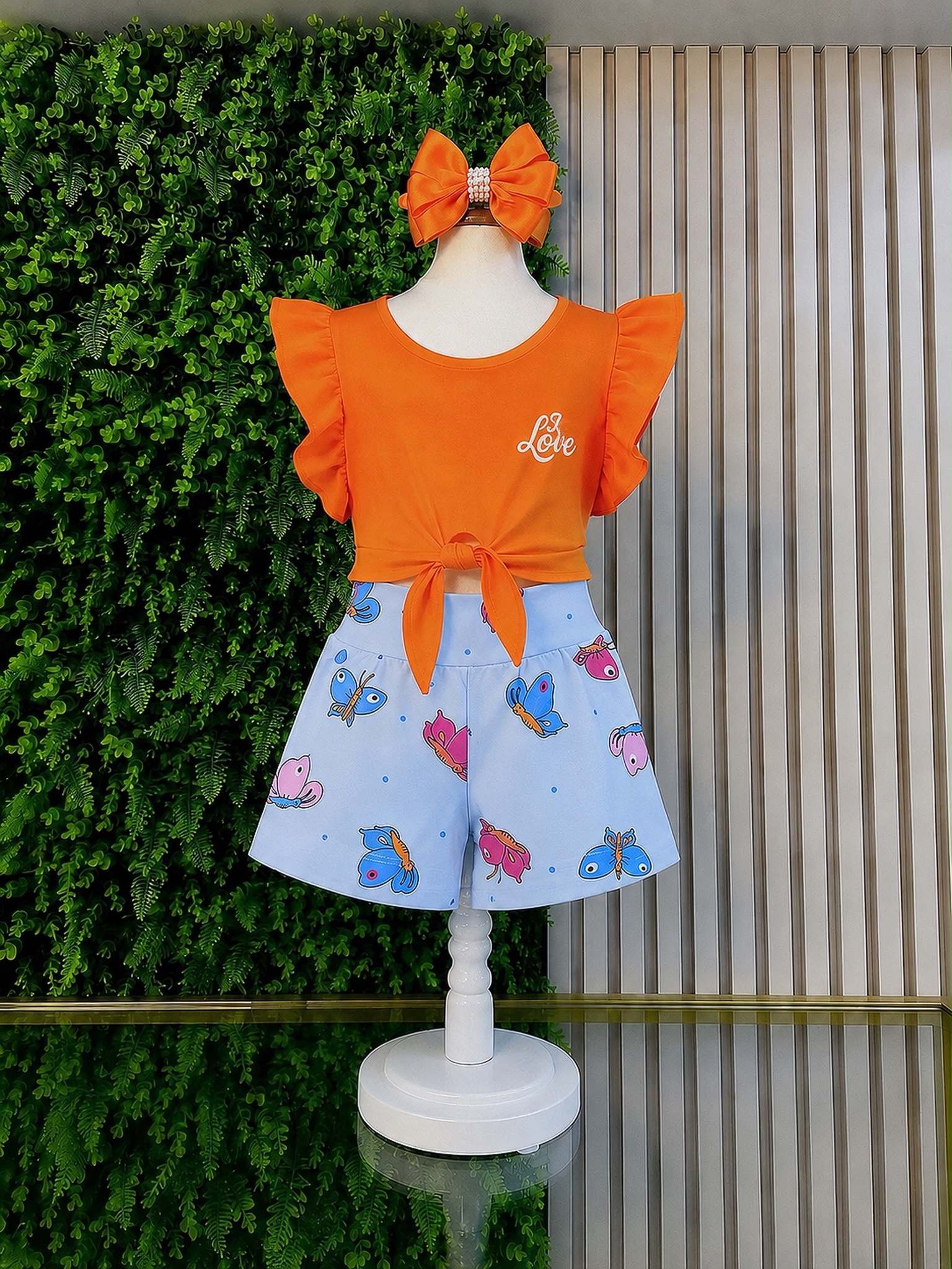 Conjunto Meninas Blusa Amarradinha Laranja e Shorts Estampa Colorida